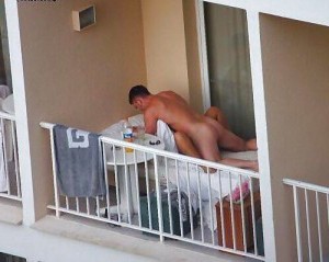 Caught in public balcony having sex
