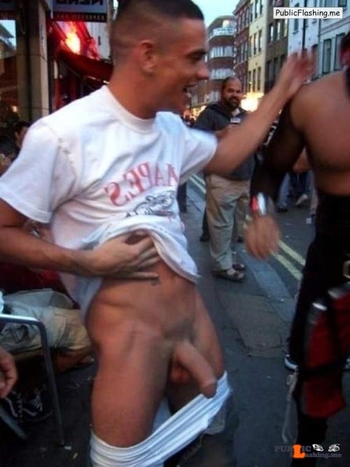dick flash photos - Street dick flasher Some guy is flashing his dick on the street while there are thousands of people. As we can see on this dick flash photo there are just males around the guy, he is happy to show off... - Dick