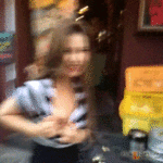 Shy Asian babe flashing boob on street