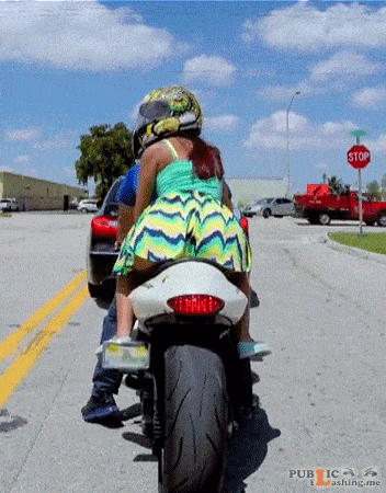 Amateur: Mini dress no panties on a bike. PERFECT! Chick with an amazing bubbly butt, pantieless as a passenger on a sports bike. She is wearing mini dress with no panties and a helmet to hide her identity. While she and her...