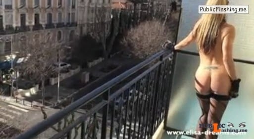 Blonde in stockings is getting nude on balcony VIDEO Public Flashing