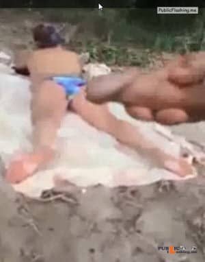 Guy is jerking off and cumming on sunbathing girl VIDEO Public Flashing