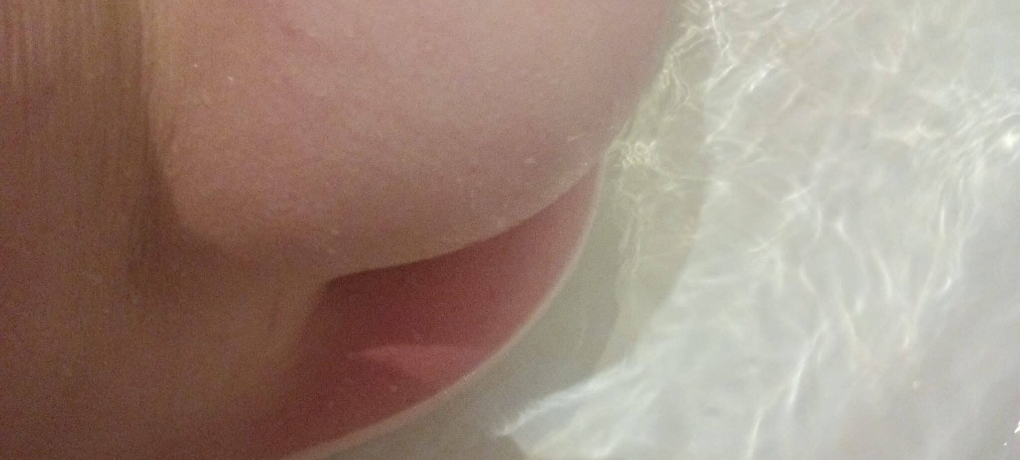 Amateur: College Coed’s Shaved Pussy in Bathtub College coed's shaved pussy visible in bathtub close-up, highlighting natural nudity and underwater intimacy without explicit activity.