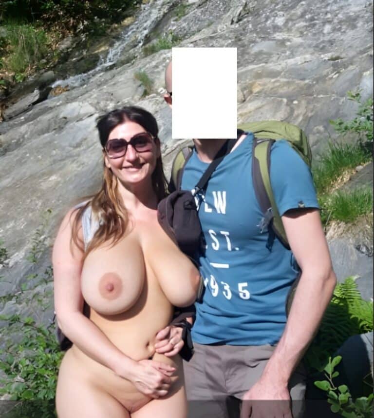 Mature MILF Flashes Her Pussy in Public with Husband’s Arm Around Her