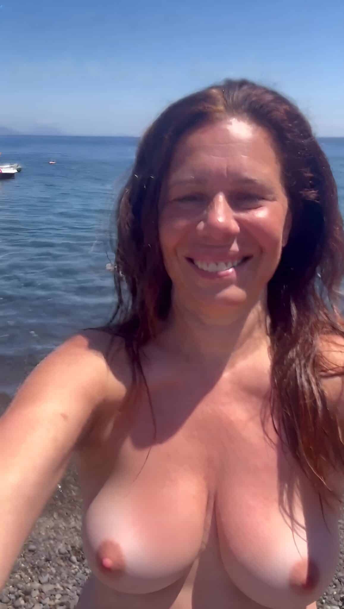 Amateur: Alessandra Gianotti’s Beach Babe Moment Alessandra Gianotti, a mature MILF, poses nude on a beach, her huge boobs and curvy body on full display, enjoying a moment of public nudity.